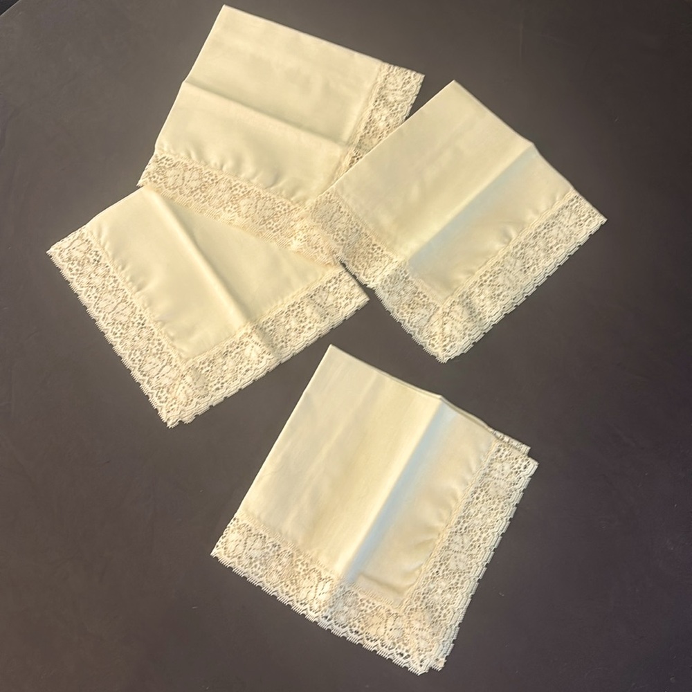 4 cream colored cloth napkins